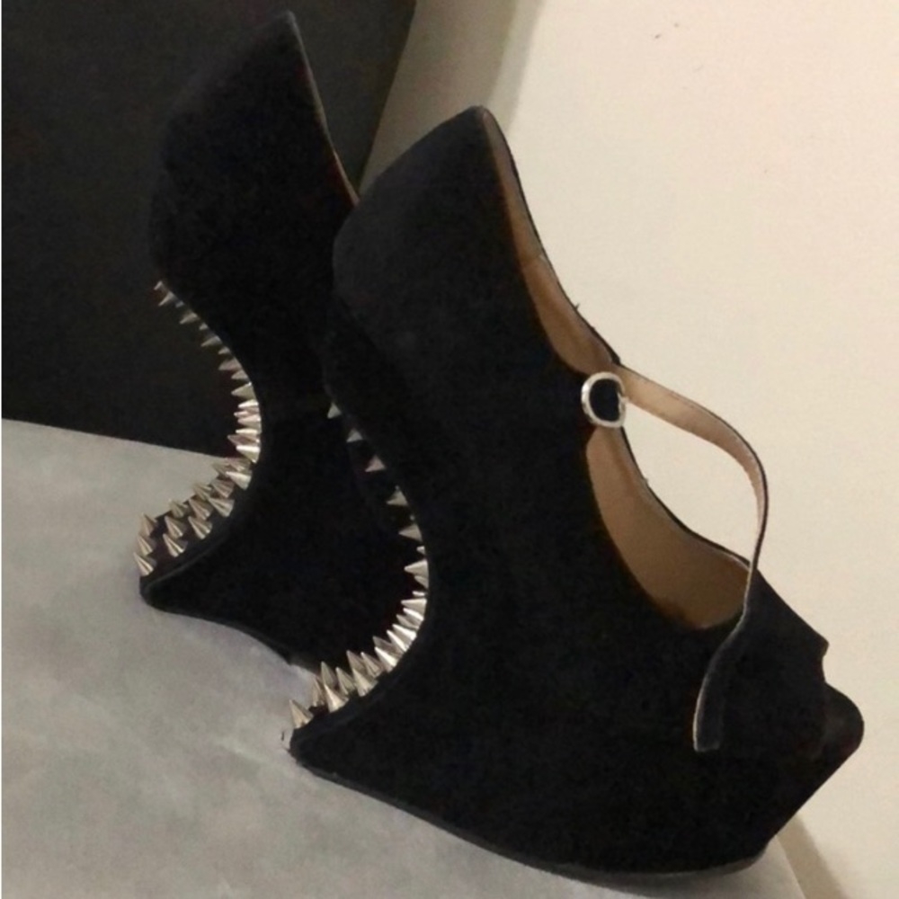 Selling a size 6.5 pair of platform wedges.  They are suede with spikes.